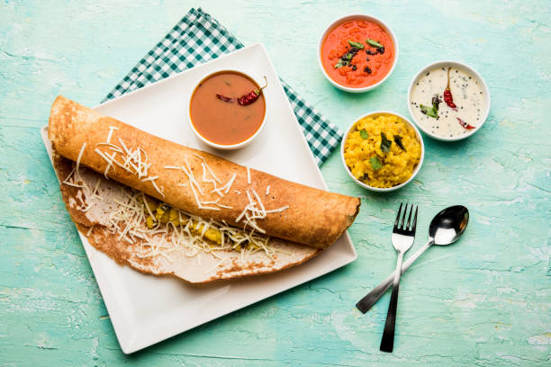istock cheese masala dosa recipe with sambar and chutney, selective focus 1156897095