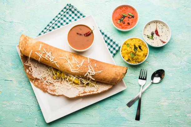 istock cheese masala dosa recipe with sambar and chutney, selective focus 1156897143