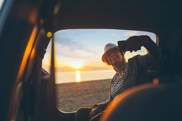 istock Watching the sunset on the beach 1156901705