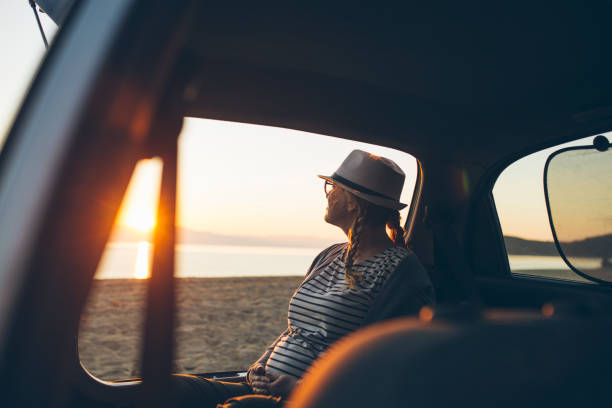 istock Watching the sunset on the beach 1156902243