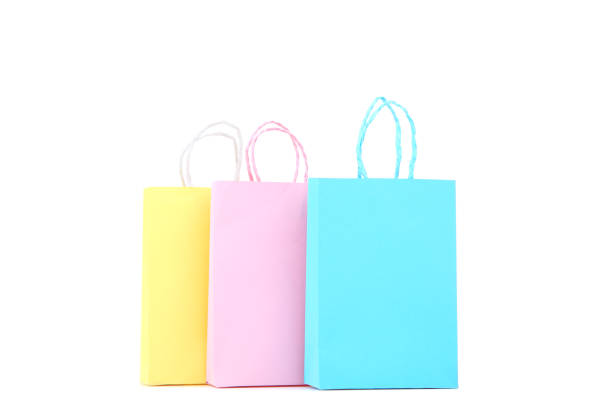 istock Small paper shopping bags isolated on white background 1156903023
