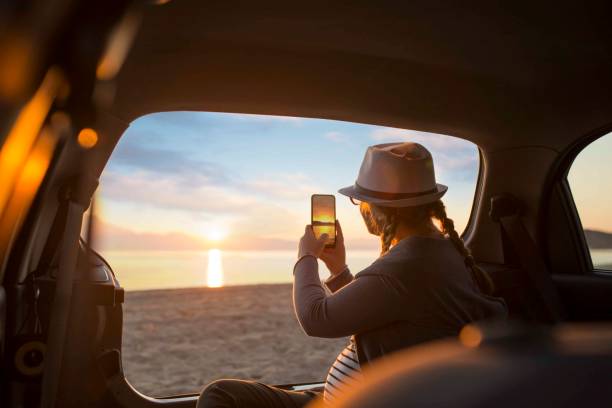 istock Watching the sunset on the beach 1156903161