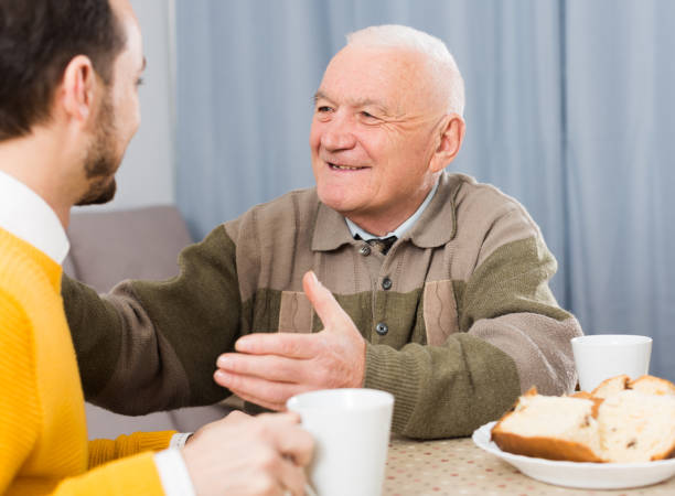 istock Elderly father and son breakfast 1156903422