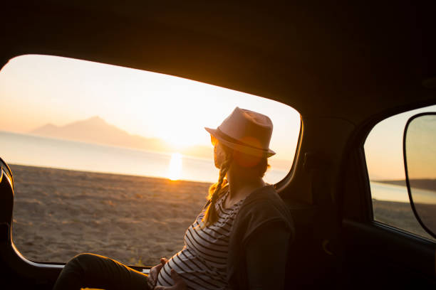 istock Watching the sunset on the beach 1156903489
