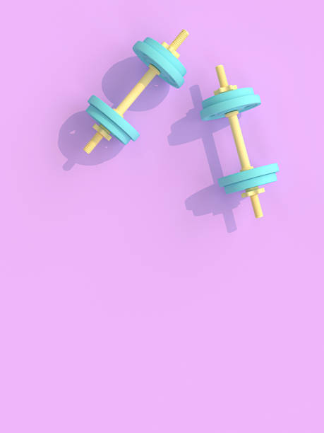 istock yellow and blue dumbbells on violet background. 1156903497