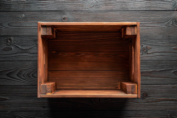 istock empty wooden box on wooden table, top view 1156903587