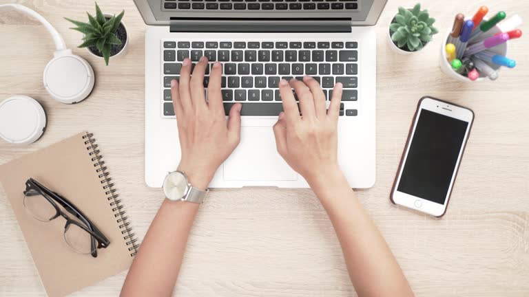 Woman typing laptop