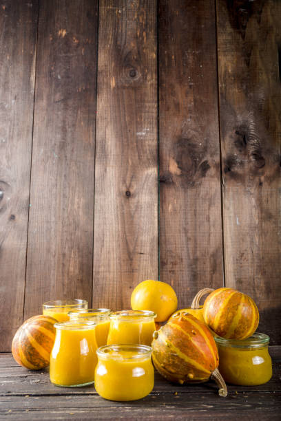 istock Pumpkin puree in different glass jars 1156904912