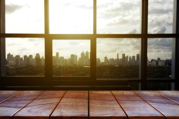 istock Empty wooden table space platform and blurred city background for product display montage 1156906120