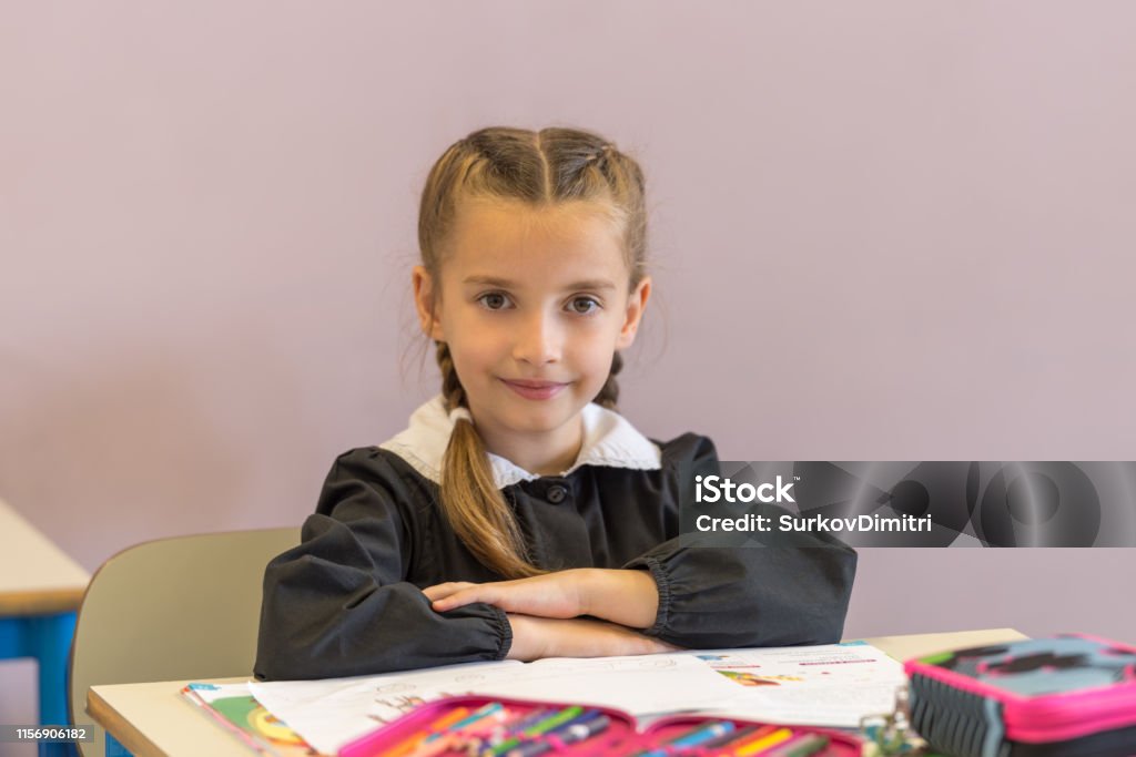 Elementary school student in classroom Pretty elementary school girl working on assignment in classroom 6-7 Years Stock Photo