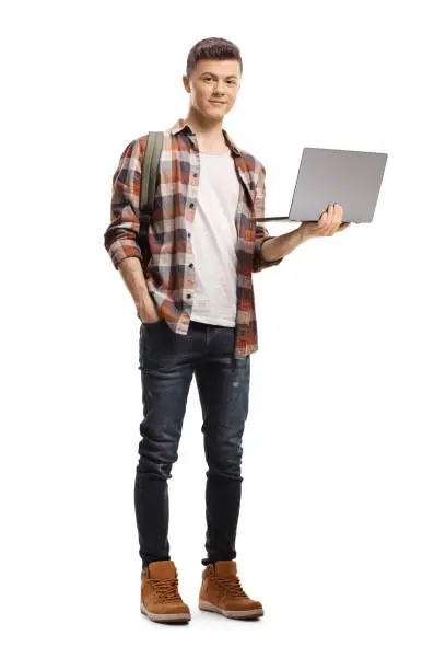 Photo of Male student holding a laptop computer and looking at the camera