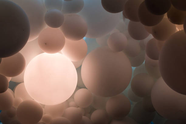istock Abstract background of many illuminated spheres 1156910633