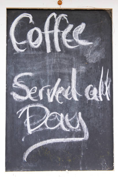 istock Coffee served all day sign written with chalk on blackboard 1156910741