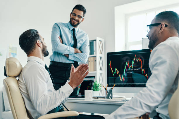 istock Working with investments. 1156912527