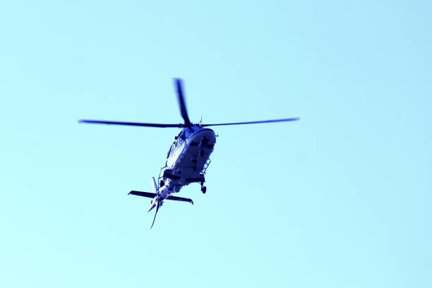 istock Beautiful modern helicopterisolated against sky 1156913609