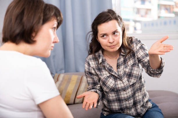 istock Two unhappy woman having conflict at home 1156915061
