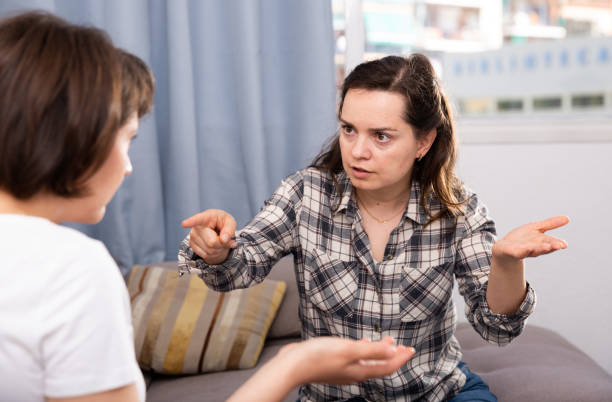istock Woman pointing to mistakes to her elderly  sister while quarrel 1156915068