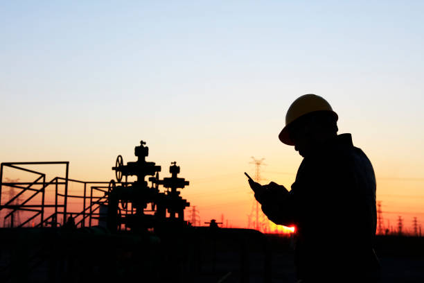 istock oil field, the oil workers are working 1156915327