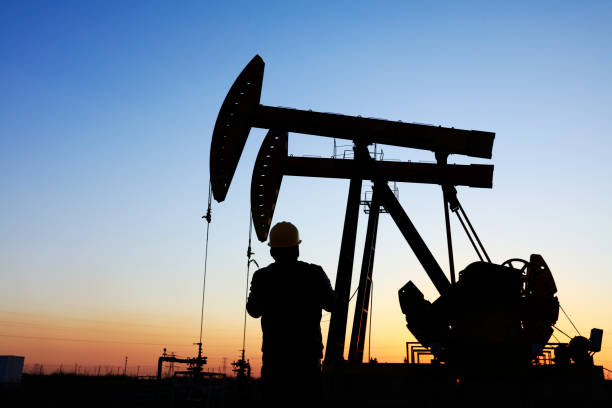 istock oil field, the oil workers are working 1156915351