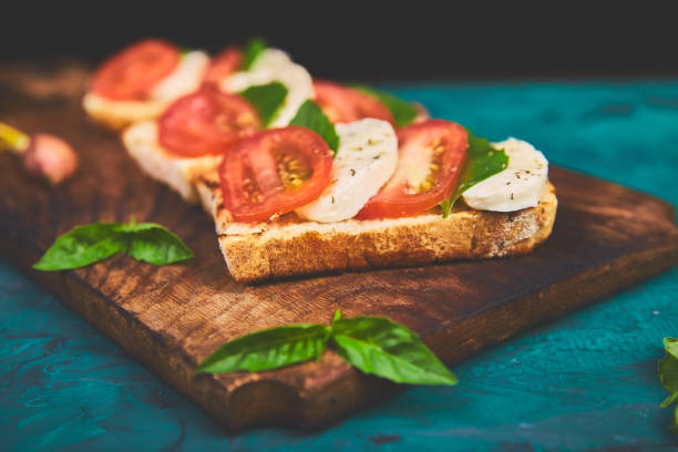 istock Bruschetta with tomatoes, mozzarella cheese and basil 1156916773