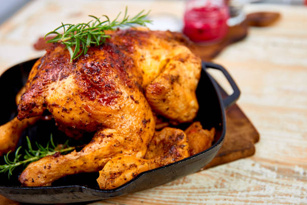istock Baked whole chicken with apples in pan 1156916850