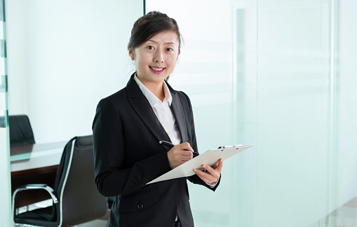 Asian business woman in a modern office.