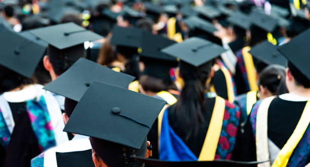 istock Rear view of graduation caps during commencement 1156917535