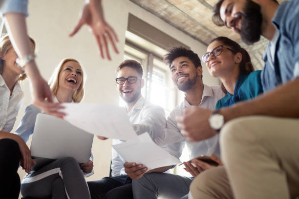 istock Successful happy group of people learning software engineering and business during presentation 1156918367