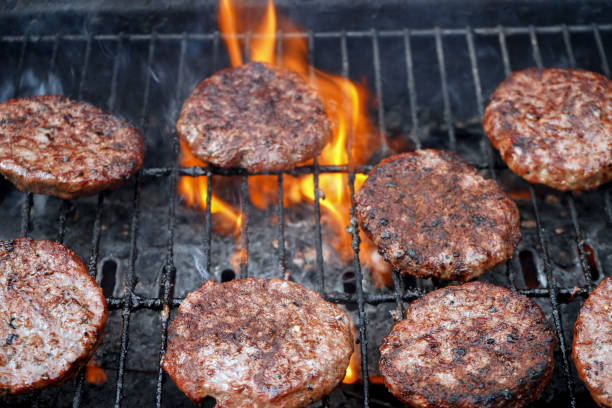 istock Burgers cooking on a BBQ 1156918637
