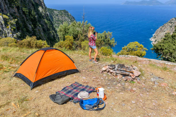 istock Woman camping with tent. 1156920278