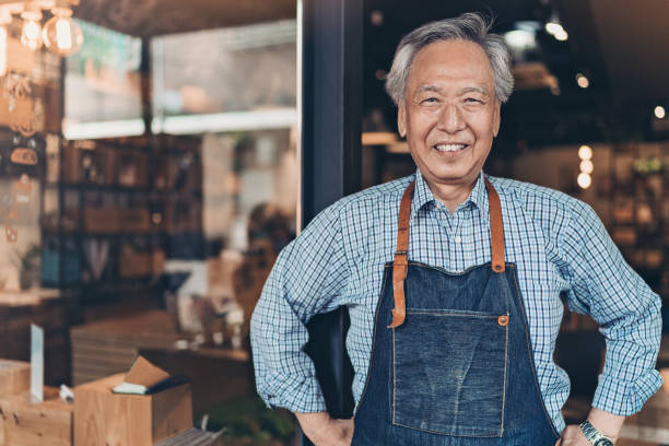 istock Senior coffee shop owner 1156921529