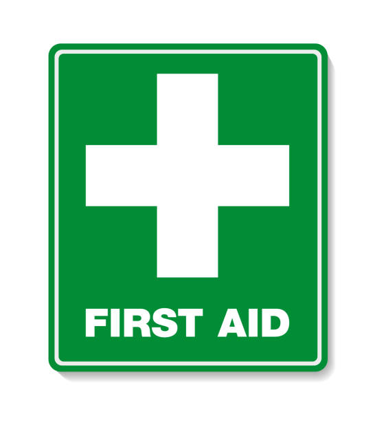 green FIRST AID sign with cross symbol green FIRST AID sign with text and cross symbol first aid stock illustrations