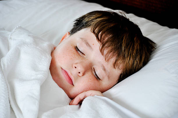 istock Sleeping Young Caucasian Boy at Home in Bed 115692324