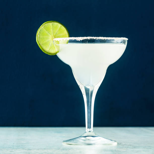 istock classic margarita cocktail on the table with bar accessories. 1156923509