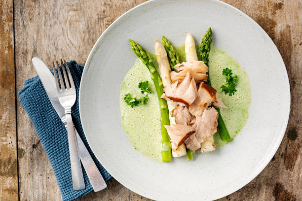 istock Green and white asparagus with flaked salmon. 1156924646