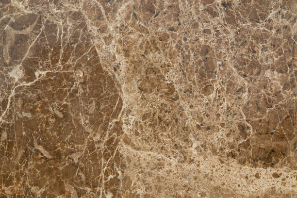 istock Yellow granite slab closeup background texture. 1156925097