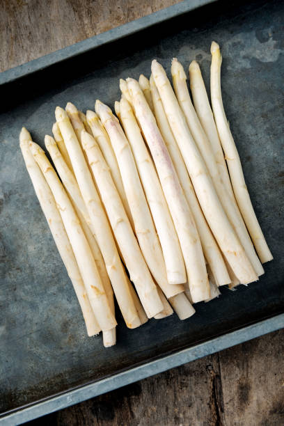 istock Tray of white asparagus. 1156925251