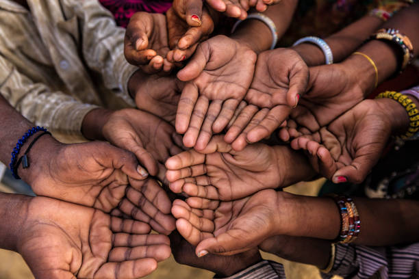 istock Hands of poor - asking for help, Africa 1156925409