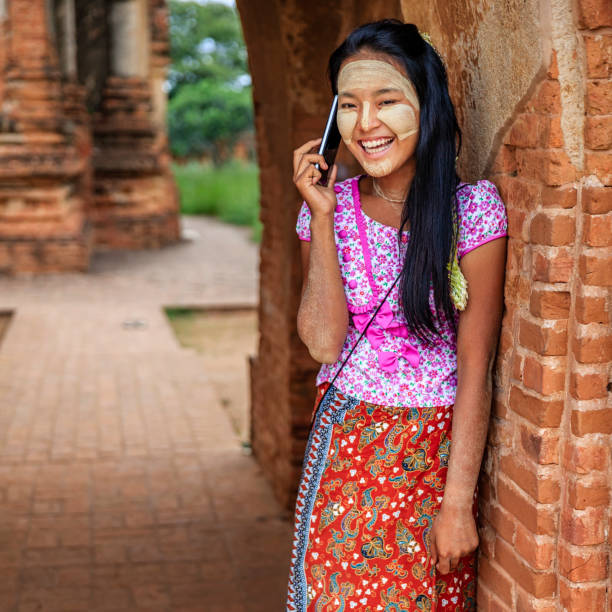 istock Young Burmese girl using a mobile phone in Bagan, Myanmar 1156925484