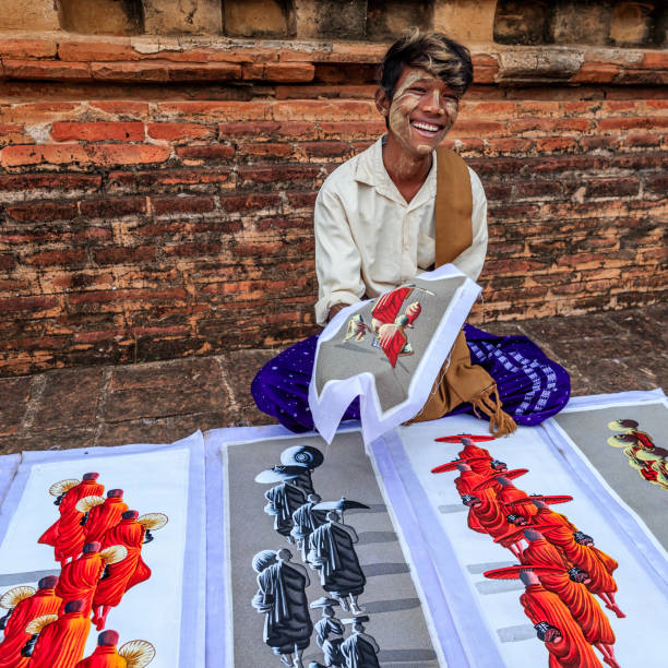 istock Young Burmese boy selling sand paintings in Bagan, Myanmar 1156925513