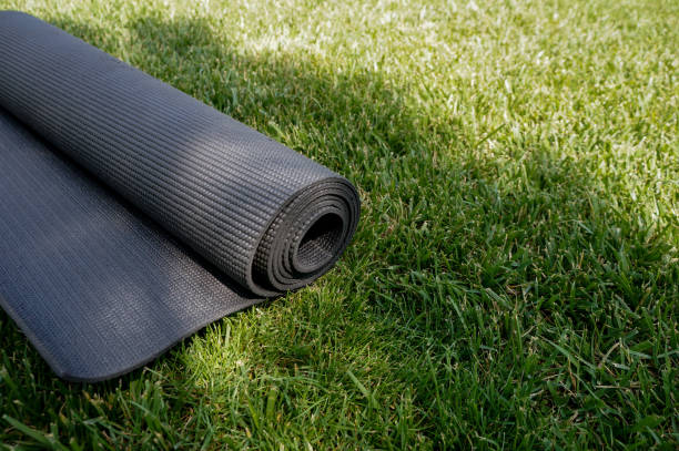 istock Yoga mat on a grass background 1156931938