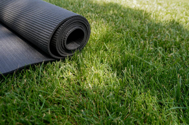 istock Yoga mat on a grass background 1156931939