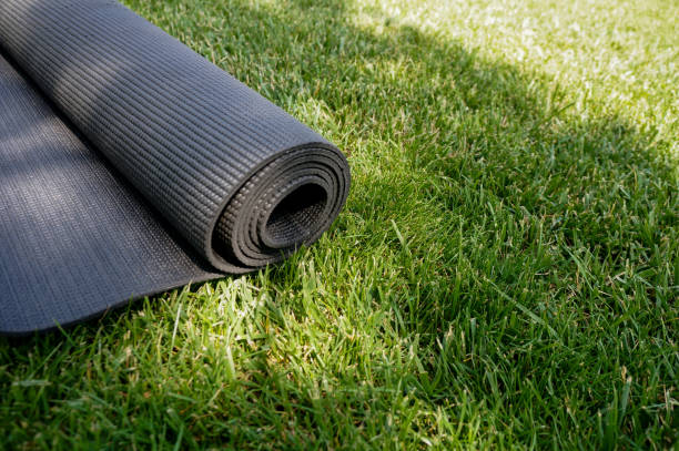 istock Yoga mat on a grass background 1156932143