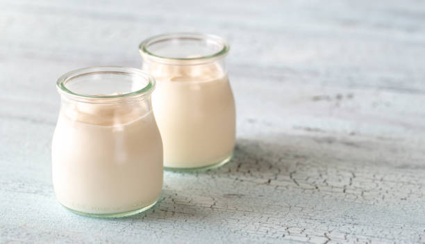 istock Two jars of Greek yogurt 1156933475