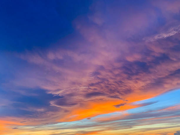 istock Dramatic sky with clouds on gold and red colour. 1156933767