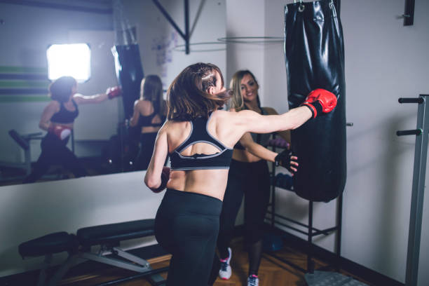 istock Woman practicing boxing in gym 1156934007