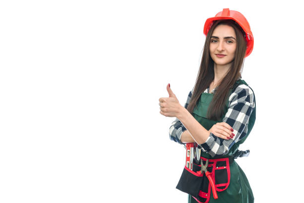 istock Young woman in coverall isolated on white 1156934450