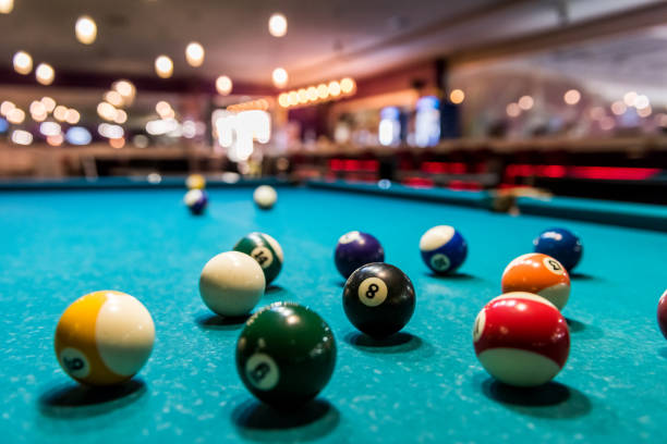 istock Colorful billiard balls on table in pub 1156935049