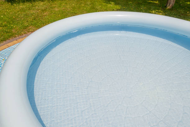 istock A round, blue, garden pool for children. 1156935111