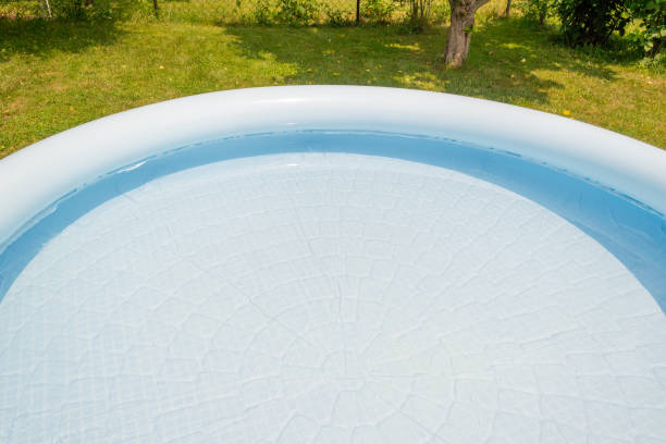 istock A round, blue, garden pool for children. 1156935135